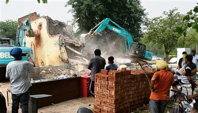 The administration demolished illegal constructions in Raipur Khurd