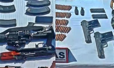 Two AK-47, M4 carbine rifles & grenades recovered from slain terrorists in J&K