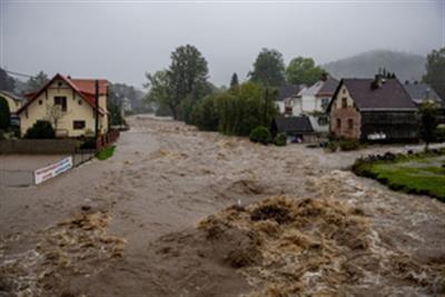 A firefighter dies as torrential rain lashes Austria