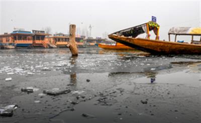 After days of sub-zero temperatures, Dal Lake in Kashmir freezes